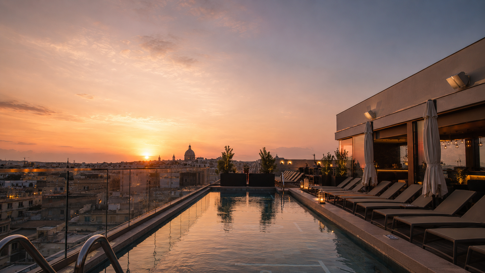 Golden-hour view over the VITA rooftop pool in Malta